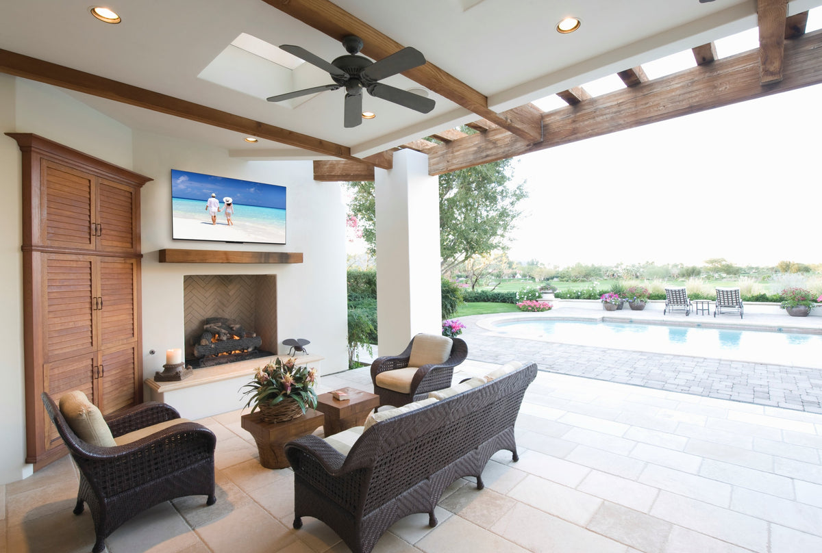 Peerless-AV SOSTV65 Neptune Shade Series outdoor TV installed on covered patio