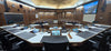 The Placer County Board of Supervisors chamber in Auburn, California, with Shure MX418S/C gooseneck microphones at the dais and a confidence monitor at each position.