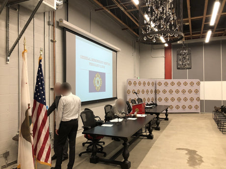 The Local 798 auditorium in San Francisco set for a general membership meeting, with the motorized projection screen, head table microphones, podium and union backdrop.