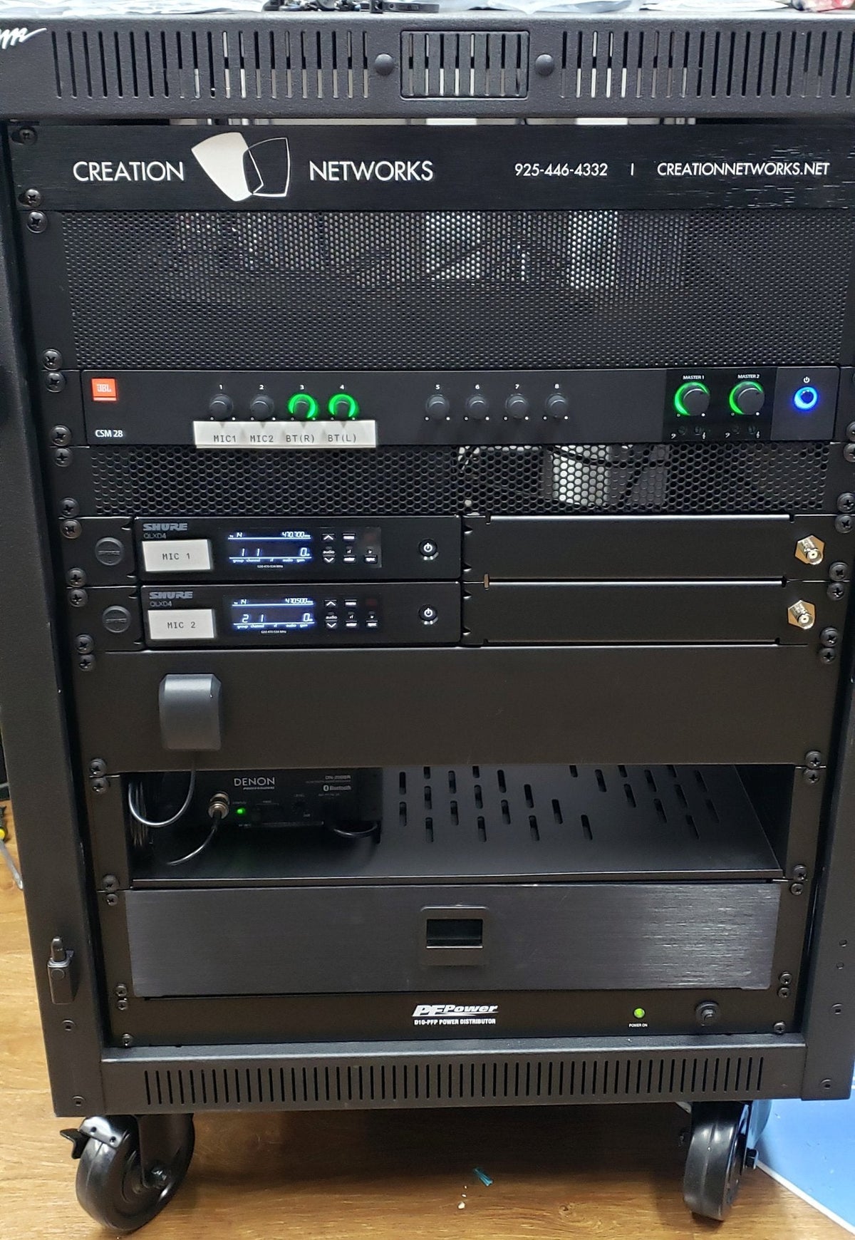 Front of the Local 798 portable sound rack, a Middle Atlantic PTRK-14 holding a JBL CSM28 mixer, two Shure QLXD4 wireless receivers, a Denon Pro DN-200BR Bluetooth receiver and a D10-PFP power distributor.