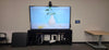 San Mateo County WIC conference room with an 86-inch Avocor AVH-8620 interactive display on a three-bay AV credenza, a QSC NC-12x80 PTZ camera above the screen and a QSC TSC-101-G3 touch panel on the wall