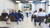 A presentation in a modern conference room with an audience.