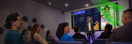A presentation in progress with audience observing a screen.
