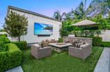 Peerless-AV ODTV7504 outdoor TV installed with soundbar on patio