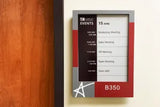EPS 125 ePaper room sign with glass mount kit on glass conference room wall